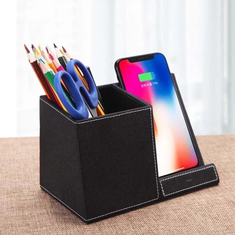 Black leather wireless charging station with pen holder compartment and phone charging surface