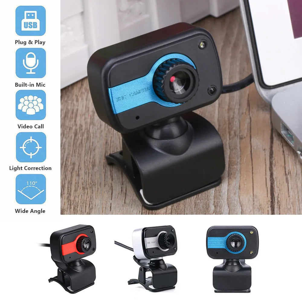 Blue mini USB webcam with a 360-degree rotating head on a desk next to a laptop.
