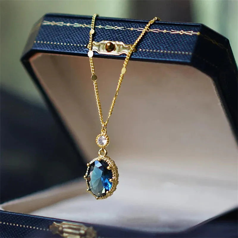 Gold geometric pendant necklace on a model, showcasing French retro design.
