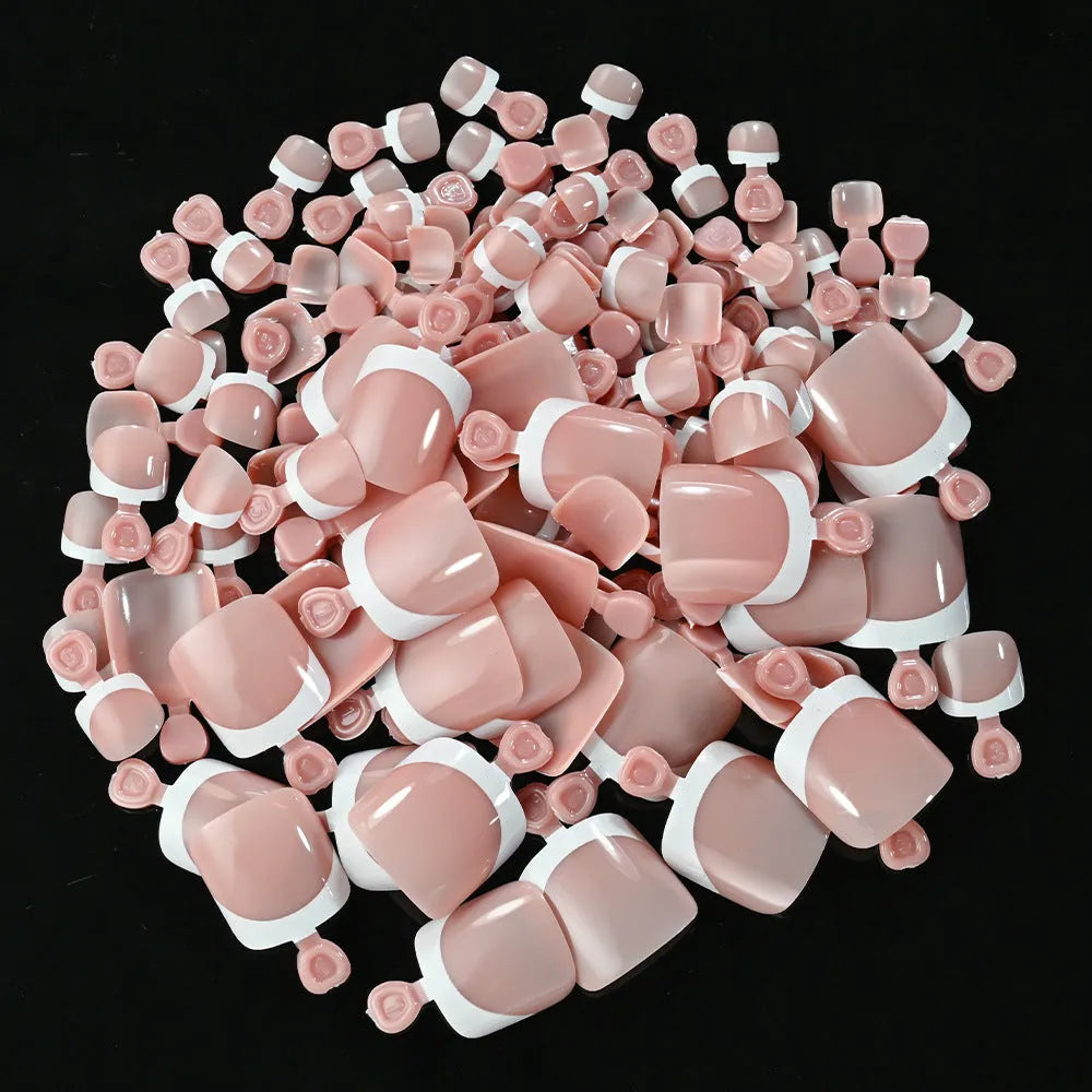 Box of 120 French white edge square short artificial nail pieces in multiple nude shades