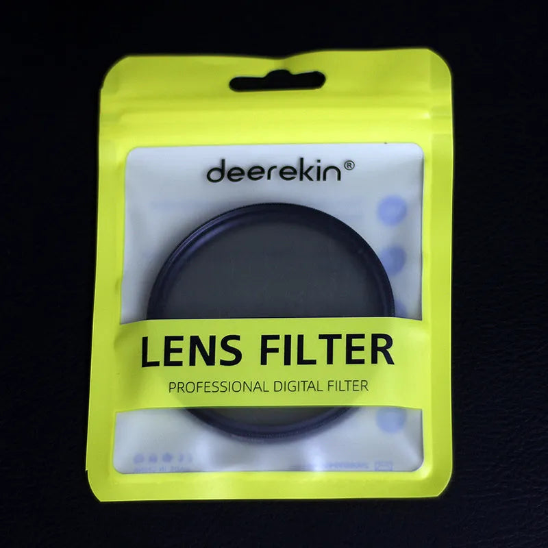 ND8 neutral density camera filter with aviation aluminium frame shown next to a lens.