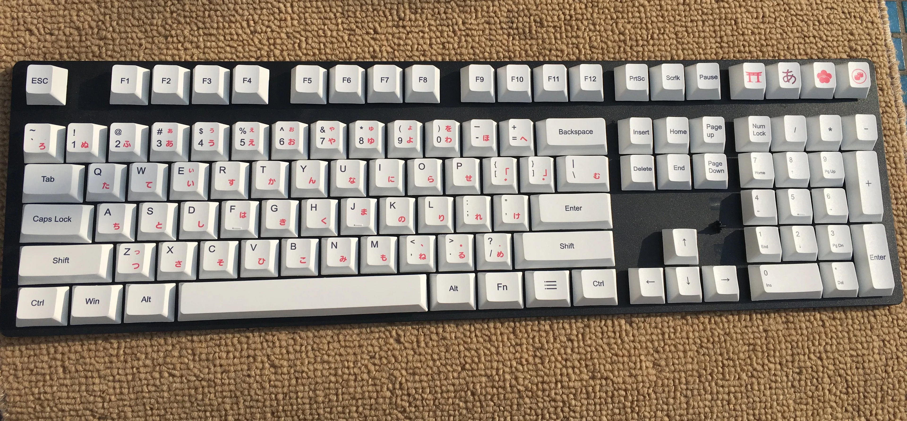 Set of PBT keyboard keycaps with Japanese, Russian, and Korean thermal sublimation legends, showing a five-sided spacebar.