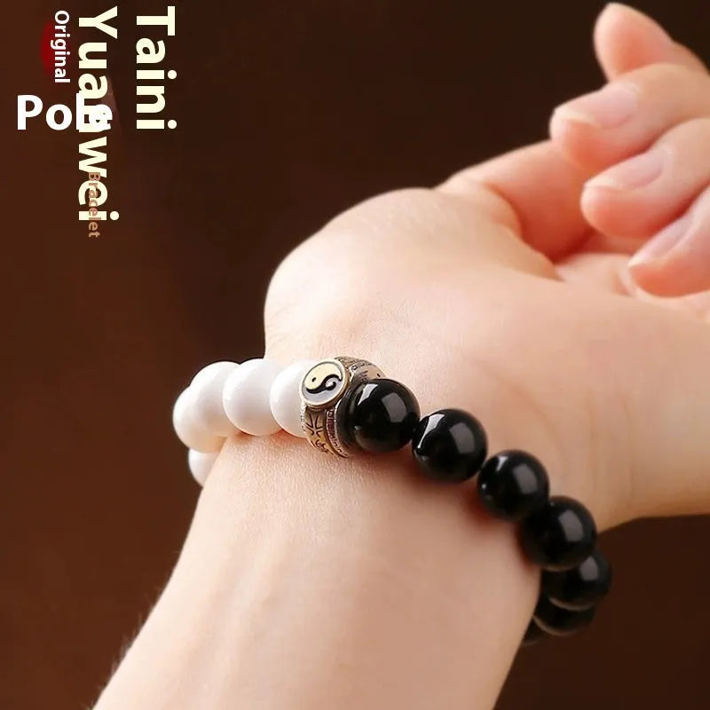 Black and white obsidian Tai Chi mantra bracelet with geometric woven beads