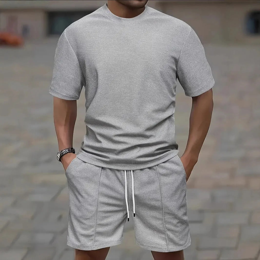 Men's apricot waffle texture short sleeve blouse and matching shorts laid flat.