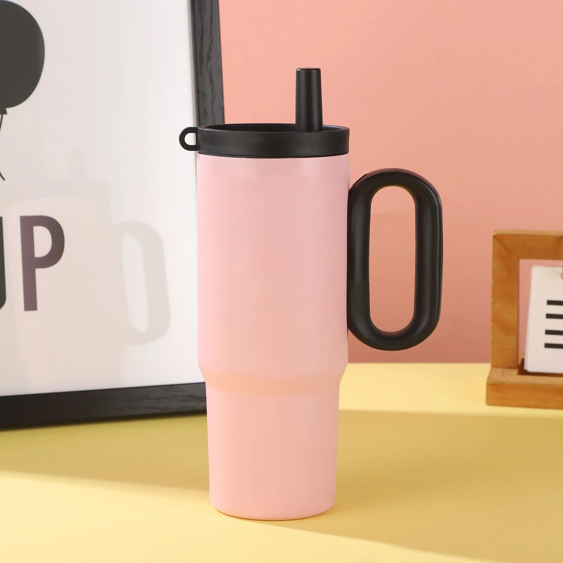 Insulated straw cup with handle showing 710ml capacity and leak-proof lid in assorted colours