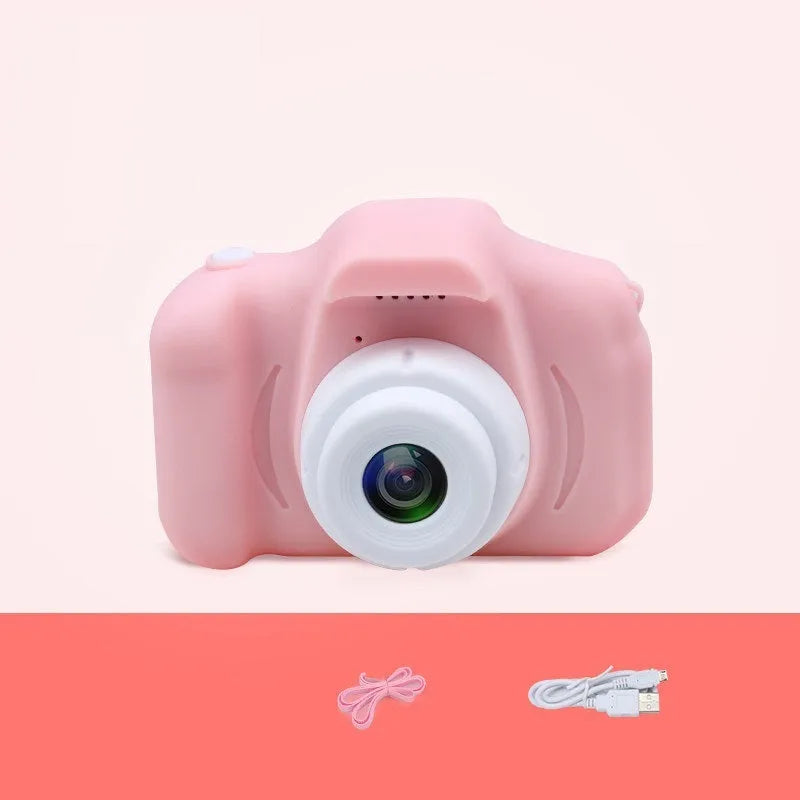 X2 HD mini cartoon kids digital camera in silicone body with 2-inch screen and lanyard.