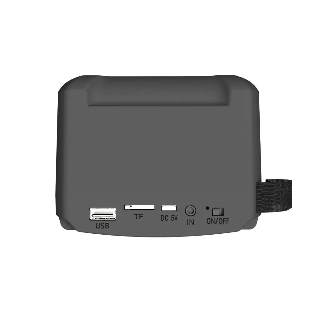 Portable Bluetooth speaker with compact design and USB charging cable