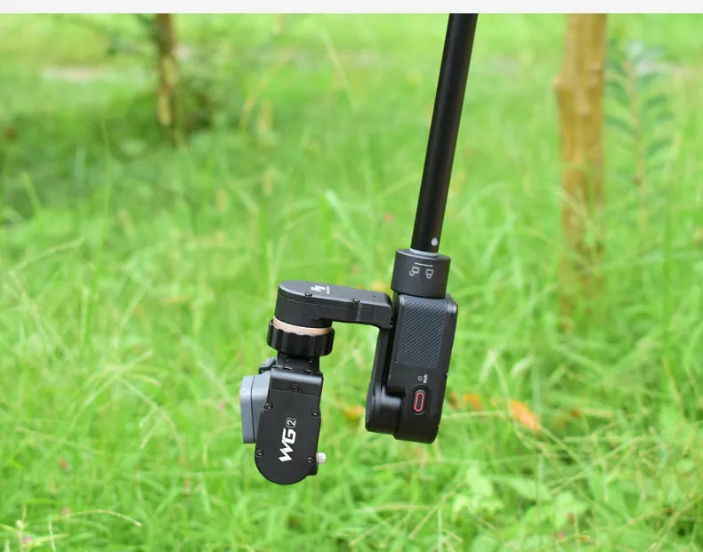 Black retractable aluminium selfie stick with foam grip, shown extended and collapsed.
