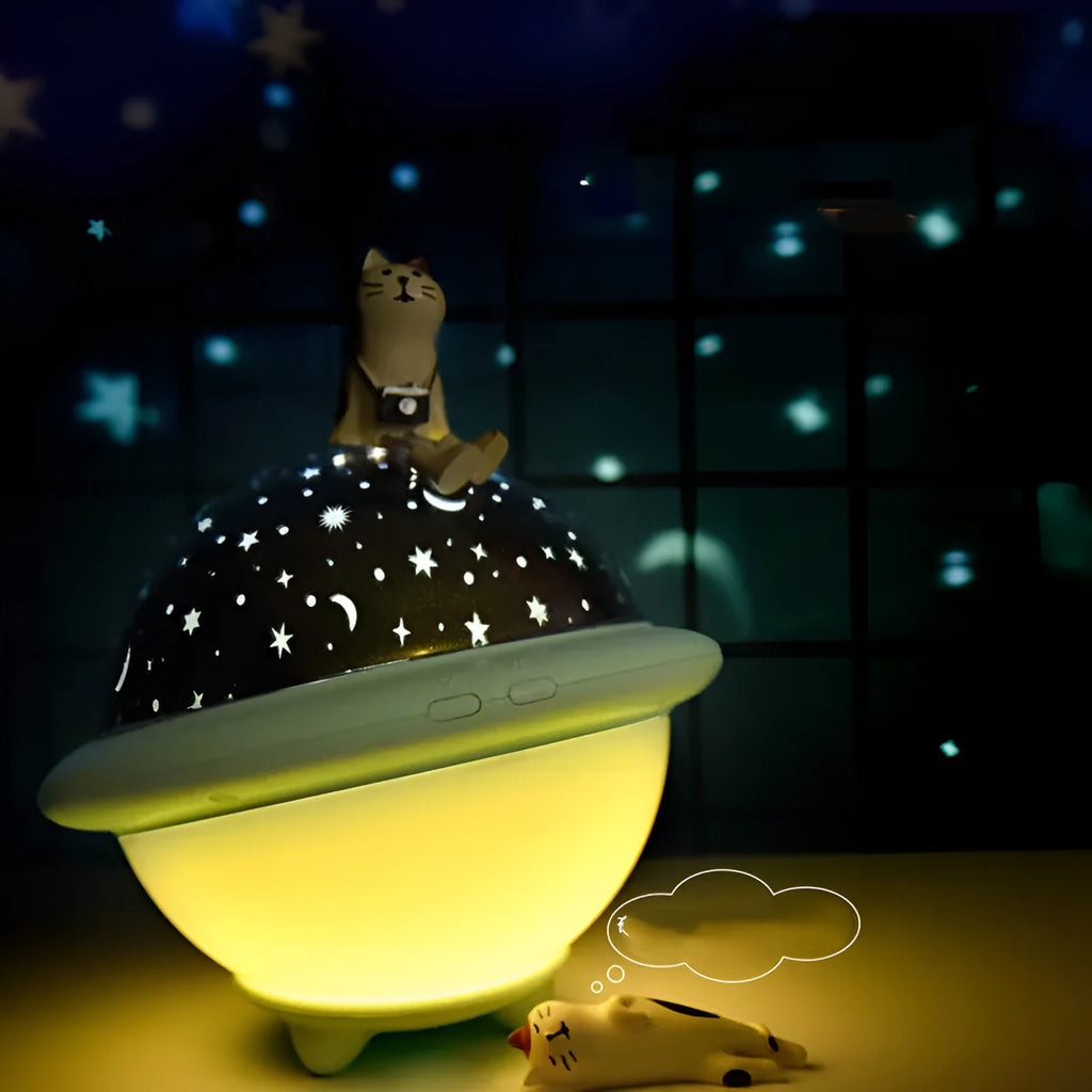 Green UFO shaped starry sky projection night light on a surface showing star projection.
