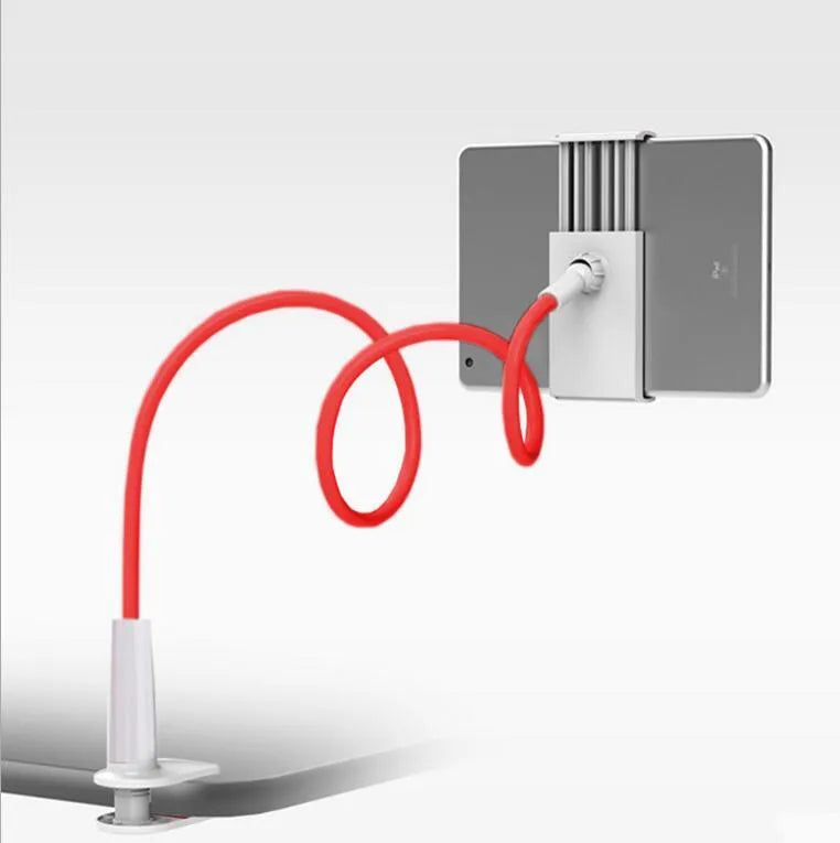 Black bedside phone handset with a long aluminium arm holding a mobile phone on a table.