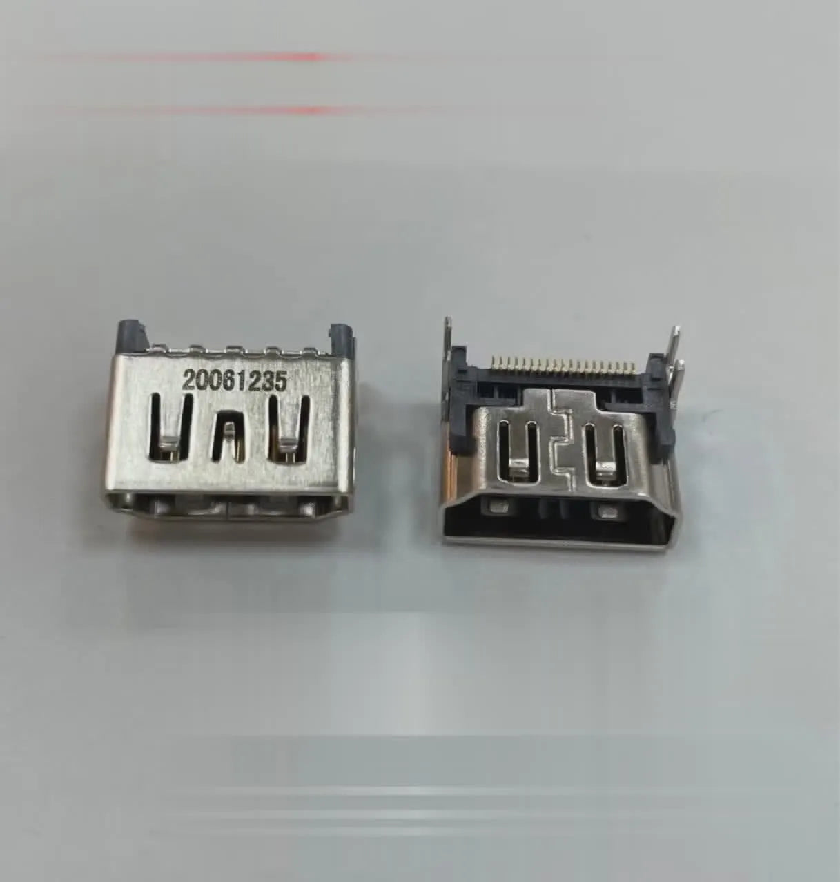 Silver HDMI host socket connector for game console repair.