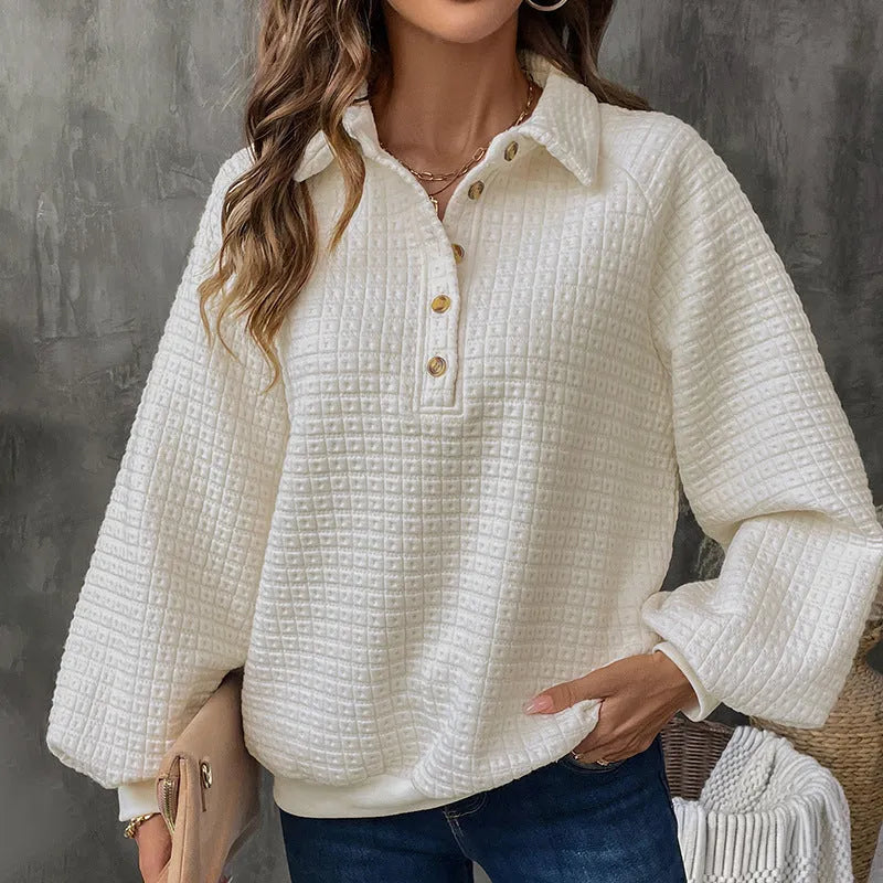 Beige women's polo collar sweater with long sleeves and a textured knit fabric.