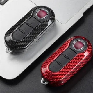 Carbon fibre and glass fibre replacement shell for car key fob on keyring.