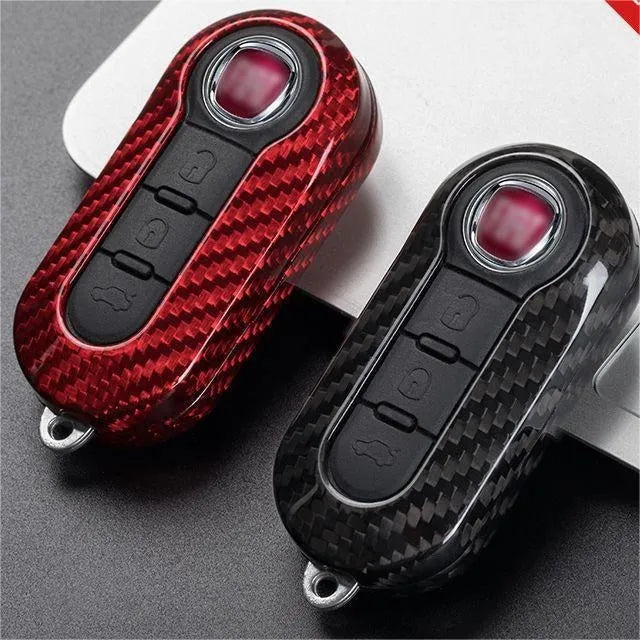 Carbon fibre and glass fibre replacement shell for car key fob on keyring.