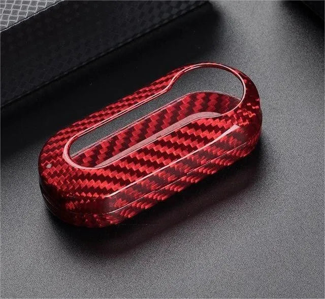 Carbon fibre and glass fibre replacement shell for car key fob on keyring.