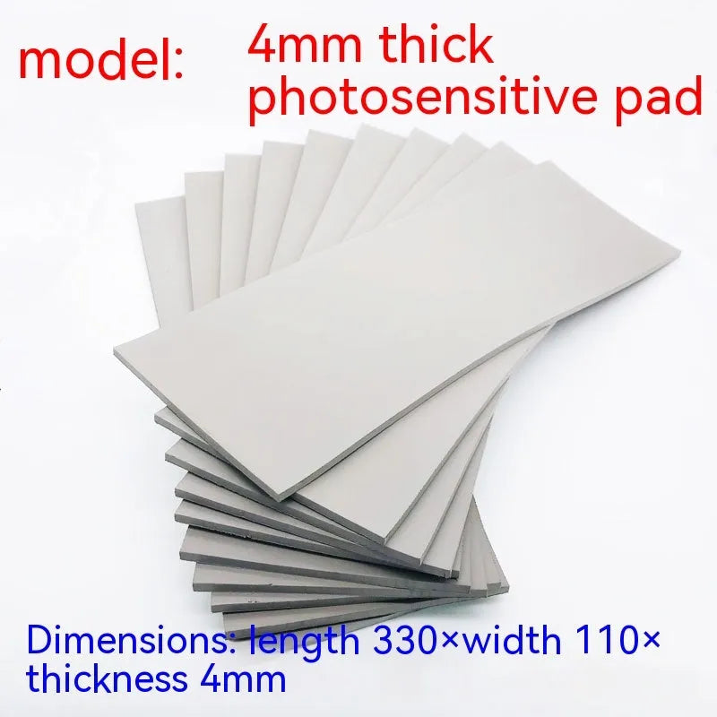 Black and grey plastic light-sensitive mat for seal pottery and calligraphy, showing 330mm by 110mm dimensions.