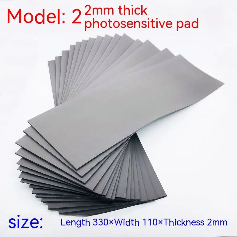 Black and grey plastic light-sensitive mat for seal pottery and calligraphy, showing 330mm by 110mm dimensions.