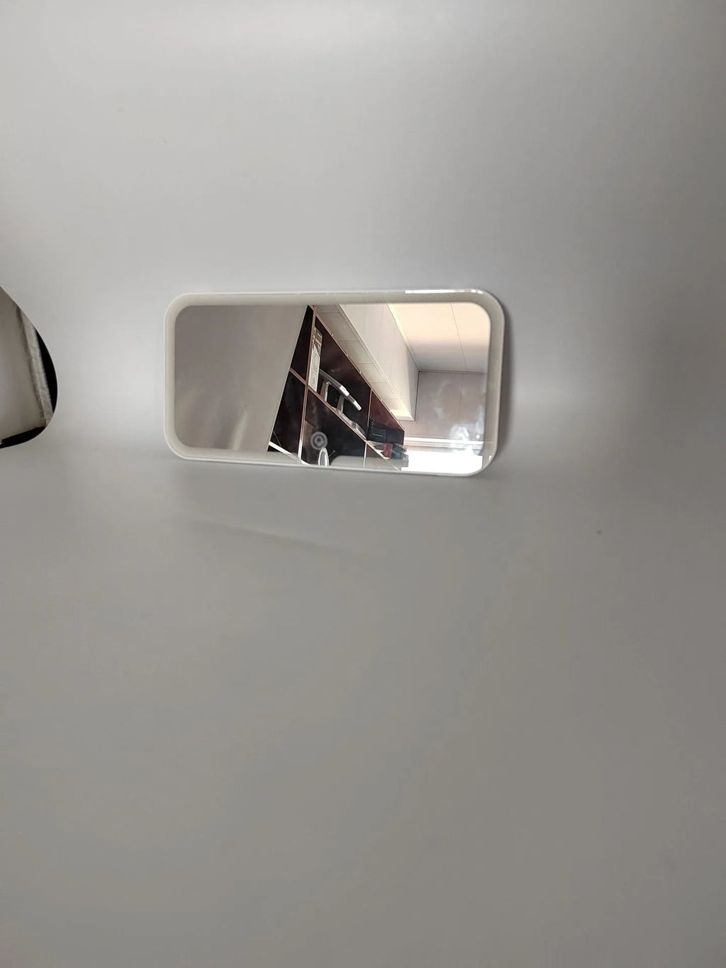 White car sun visor LED make-up mirror with aluminium lens mounted on vehicle visor