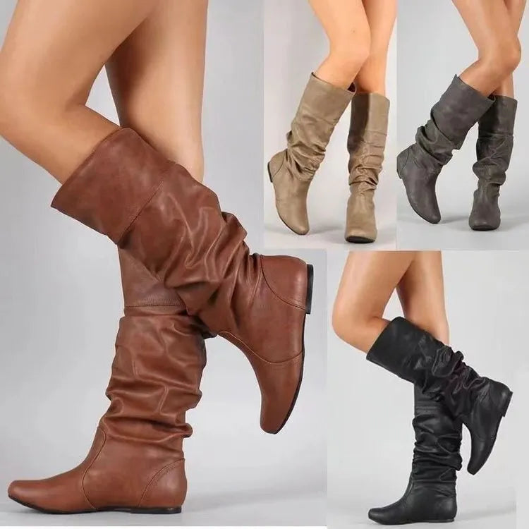 Women's flat slip-on ankle boots in black PU leather with a round toe and high-cut design.