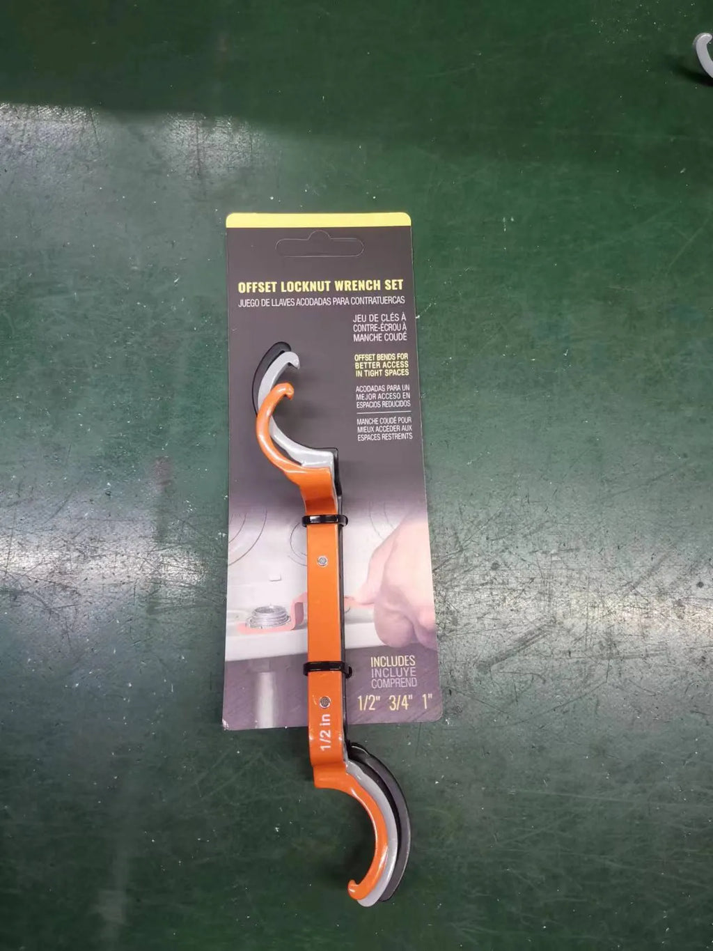Three-piece spanner set showing orange, grey, and black wrenches with magnetic suction and catheter locking functions
