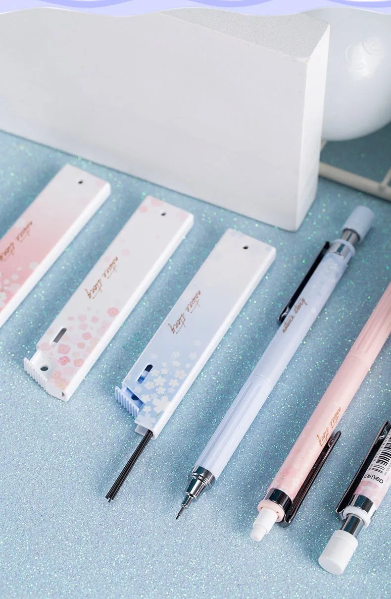 Mixed colour Sakura design propelling pencil set with three pens and three boxes of 0.5mm HB lead refills.