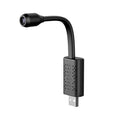Compact black V380 wireless USB HD camera on a flat surface.