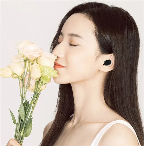 Black and white Bluetooth headphones with earbud design for wireless stereo sound