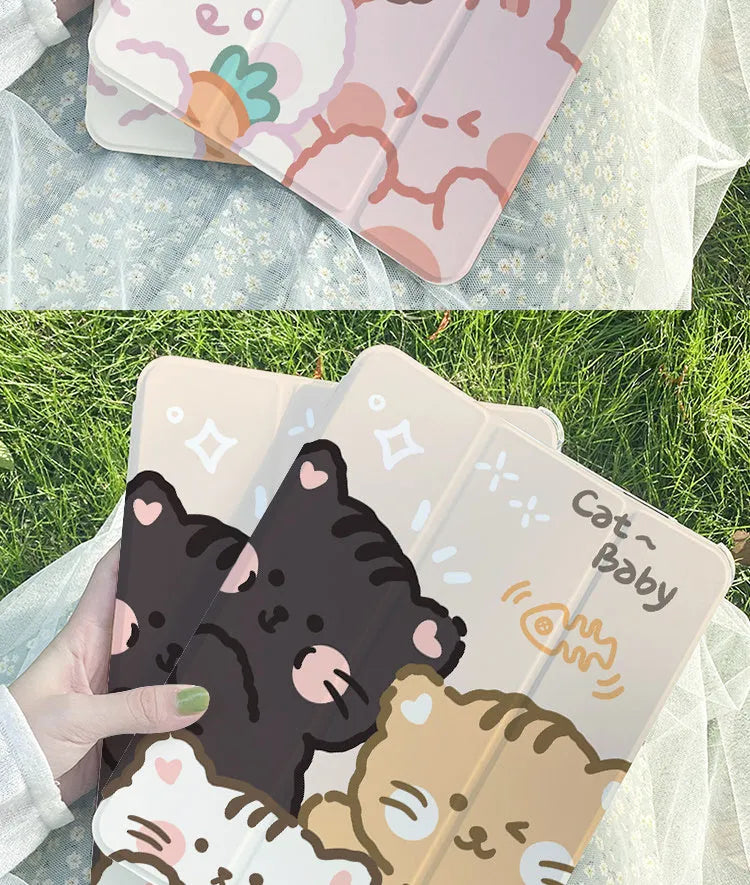 Silicone tri-fold iPad protective case with cartoon cat design, shown in stand mode.