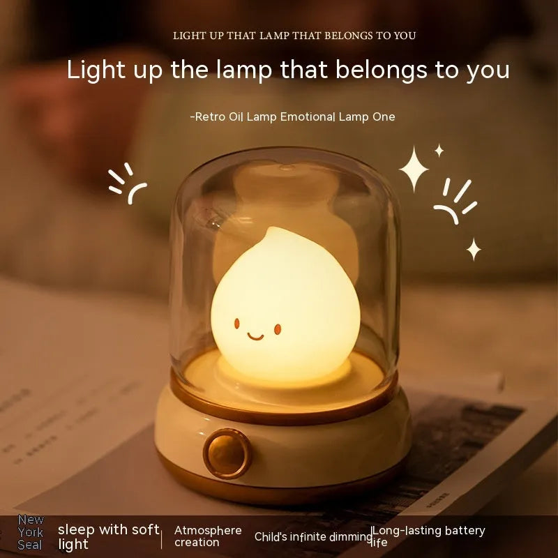 Retro oil lamp style USB rechargeable LED table lamp with dimmable lighting on wooden table