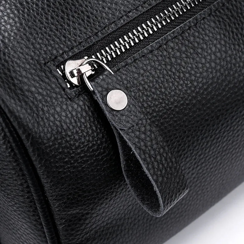 Black genuine leather one-shoulder crossbody bag showing 24cm width