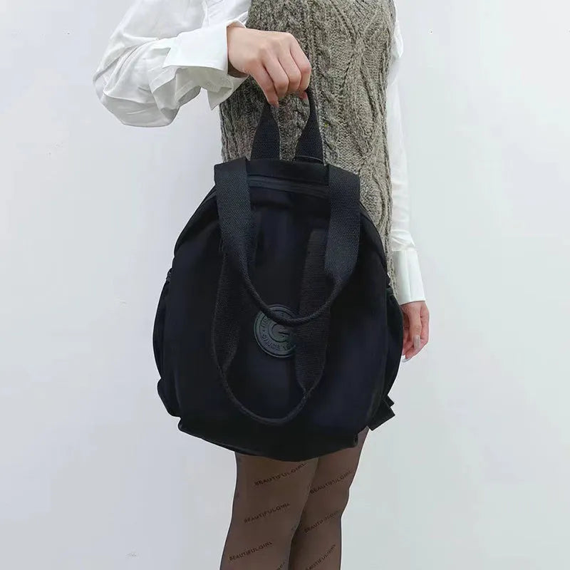 Black nylon large capacity multifunctional bag with backpack, shoulder, and handbag modes for women