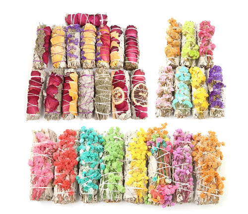 White sage and red rose petal colourful aromatherapy incense bundle on a wooden table