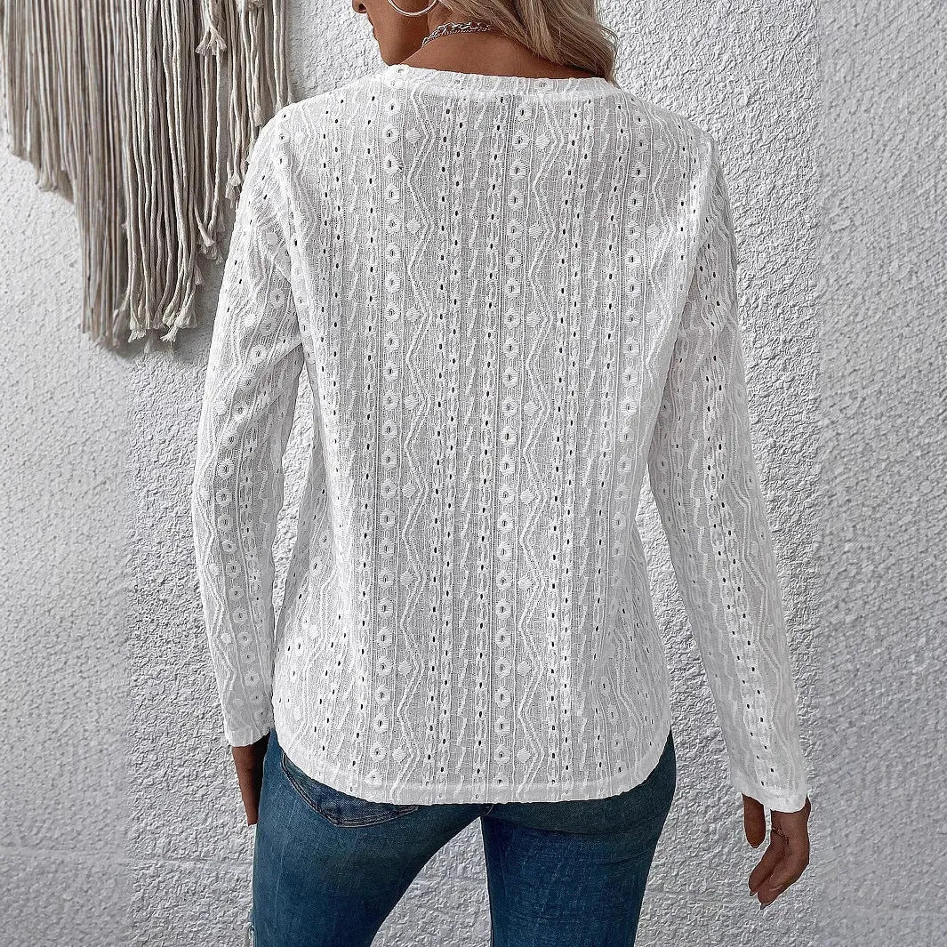 White loose-fit round neck long sleeve polyester t-shirt laid flat.