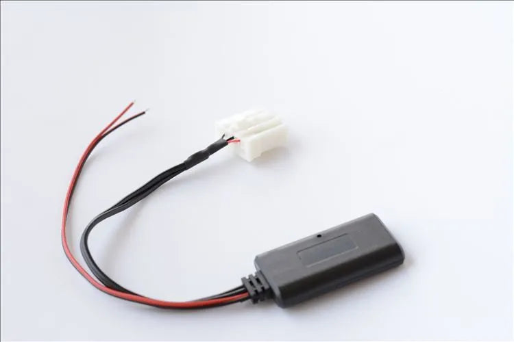 Black Bluetooth audio adapter cable for Mazda cars with aux and MEDIA button.