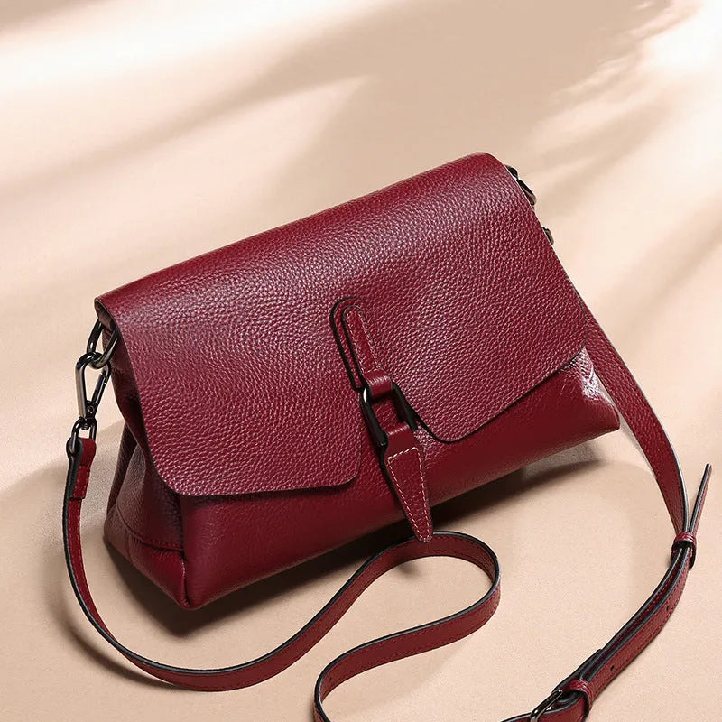 Women's soft first layer cowhide shoulder bag in black with adjustable strap and multiple pockets