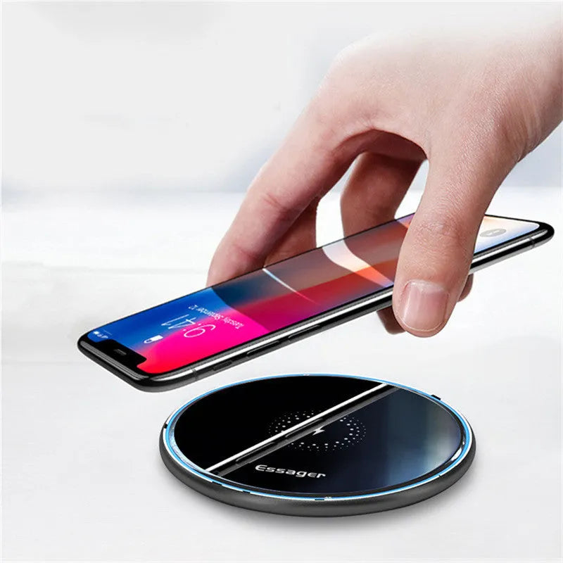 Black aluminium wireless charging pad with LED light and phone positioned for Qi charging