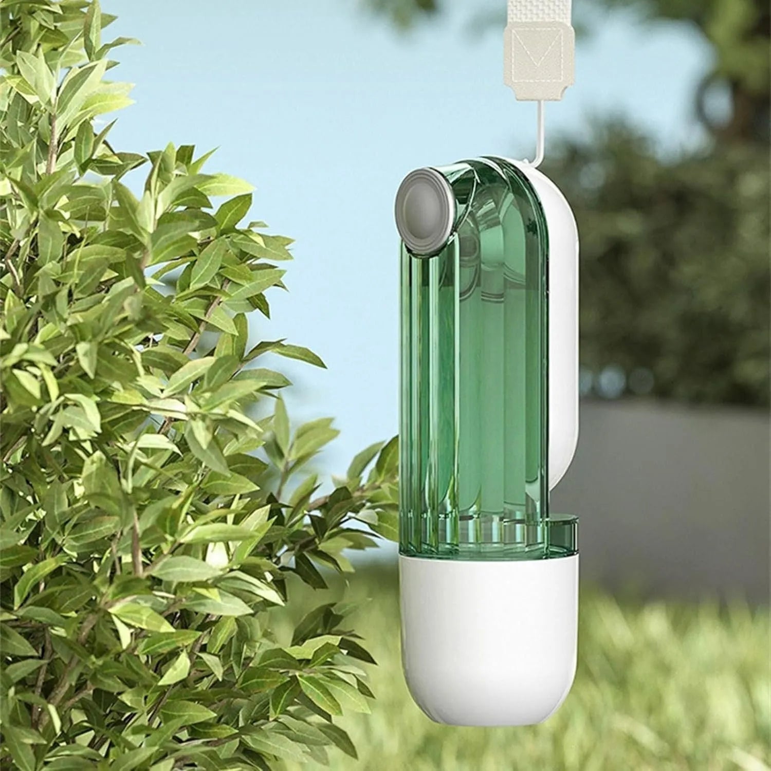 Beige dog water bottle with foldable silicone tray and integrated food dispenser base.