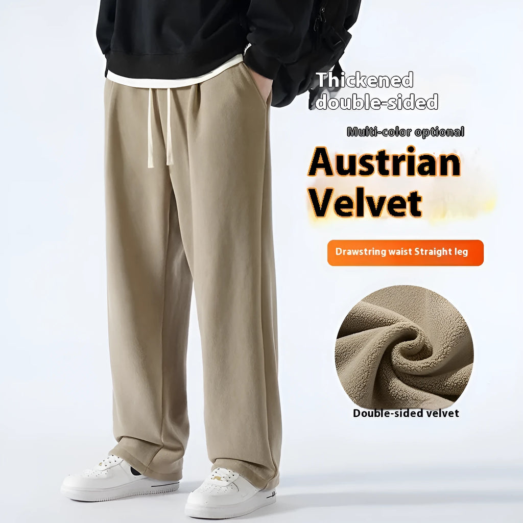 Man wearing apricot coloured loose-fit polar fleece winter sports pants with a drawstring waist.