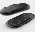 Black and white dual wireless charger showing two phones charging simultaneously on separate pads
