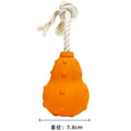Natural rubber stuffable dog toy with a long strap for fetch and interactive chewing games.