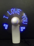 White handheld mini fan displaying a flashing blue and red 'I love you' LED pattern.