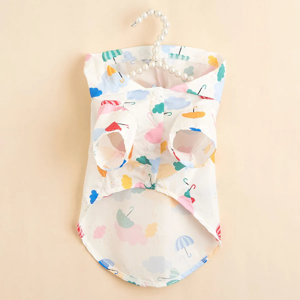 Colourful dog raincoat with a cartoon umbrella pattern, shown in size L on a mannequin.