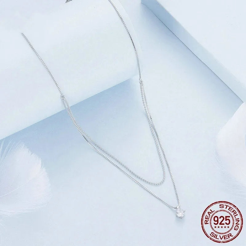 S925 sterling silver double layer necklace with pearl chain and silver alloy pendant.