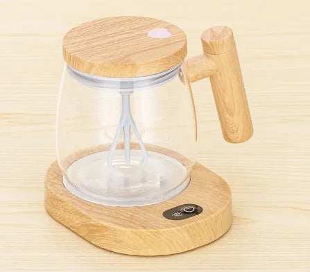 Clear borosilicate glass self-stirring coffee mug with electric base, 400ml capacity.