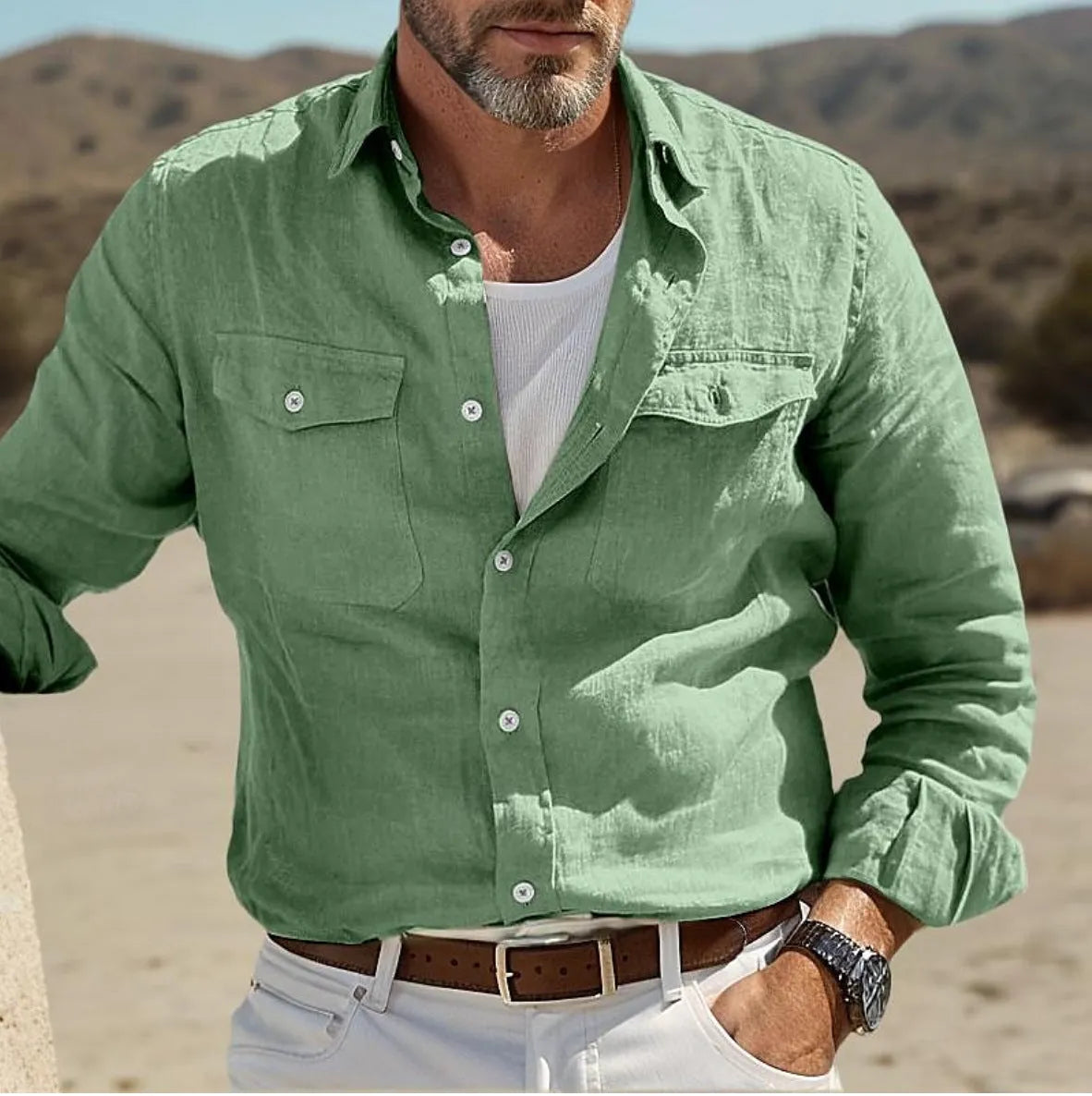 Men's solid colour long-sleeved shirt in cotton linen blend, showing loose fit and button-down front.