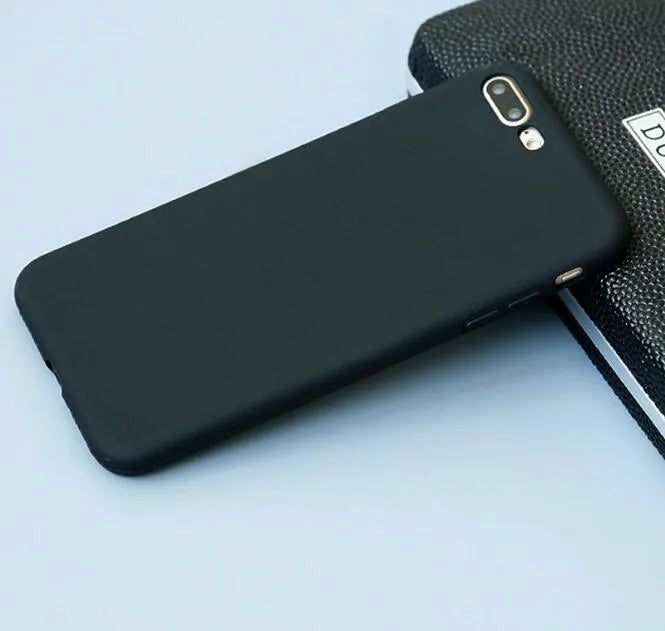 Frosted matte soft phone case for Apple iPhone models on a table.