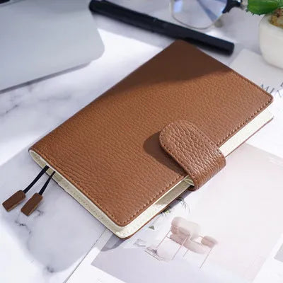 A6 size leather loose-leaf diary with a textured lychee pattern cowhide cover
