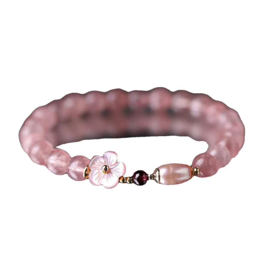 Strawberry quartz crystal bracelet with floral peach blossom design and silver-tone metal fittings