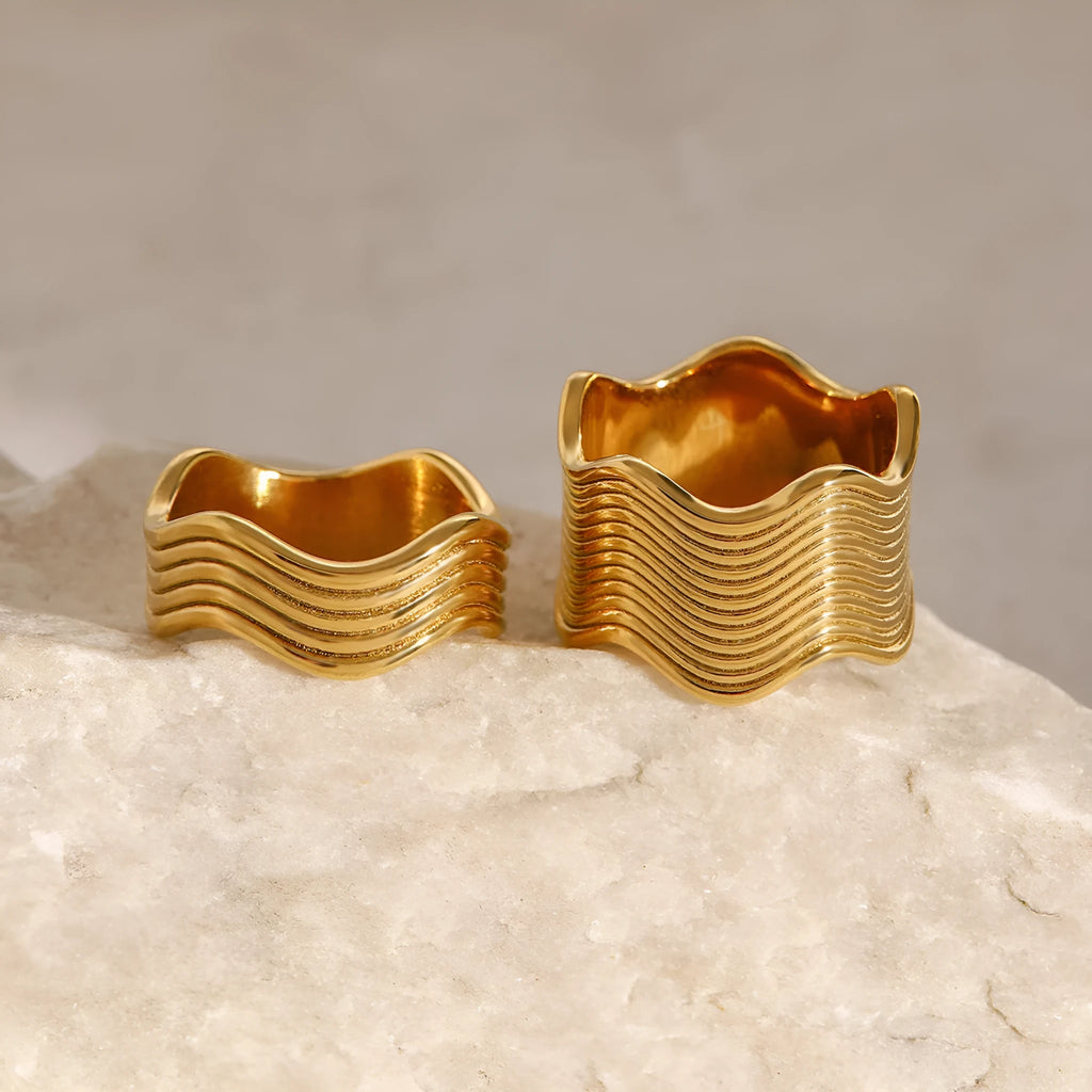 Women's stainless steel geometric ring with wide wave design in electroplated colours