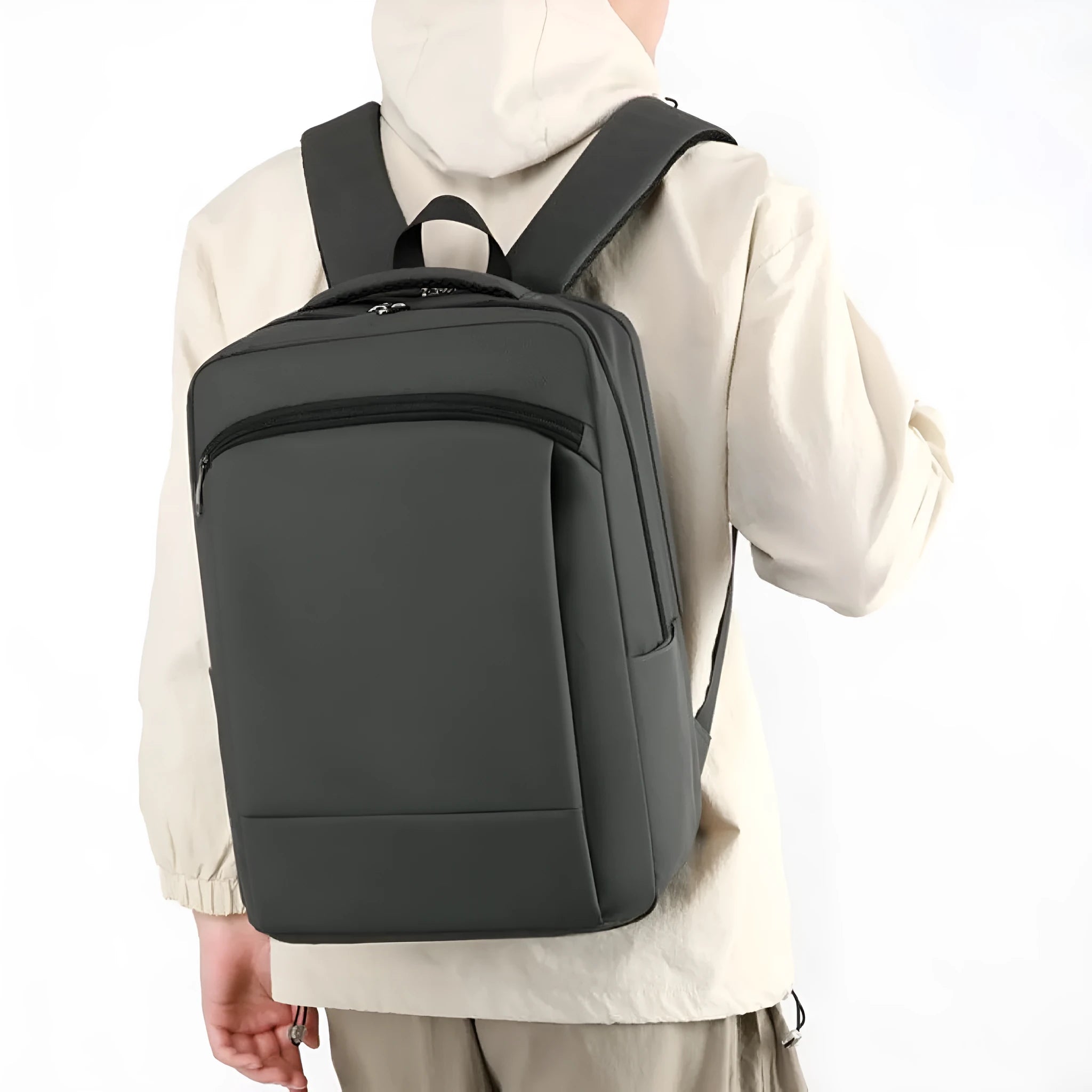 Gray casual business commute computer backpack with large capacity and curved shoulder straps on plain background